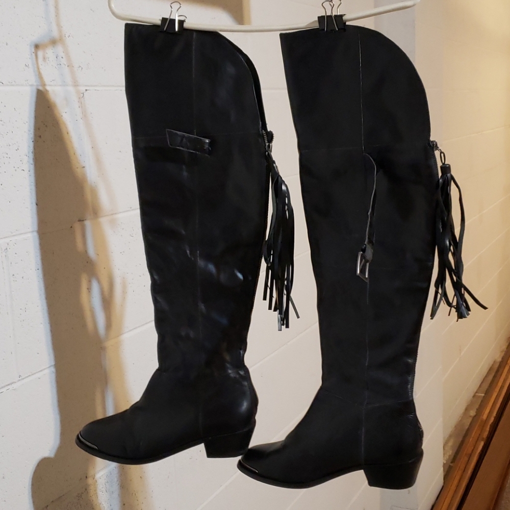 Black leather over the knee cowboy style boots